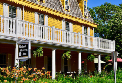 exterior of yellow building with balcony